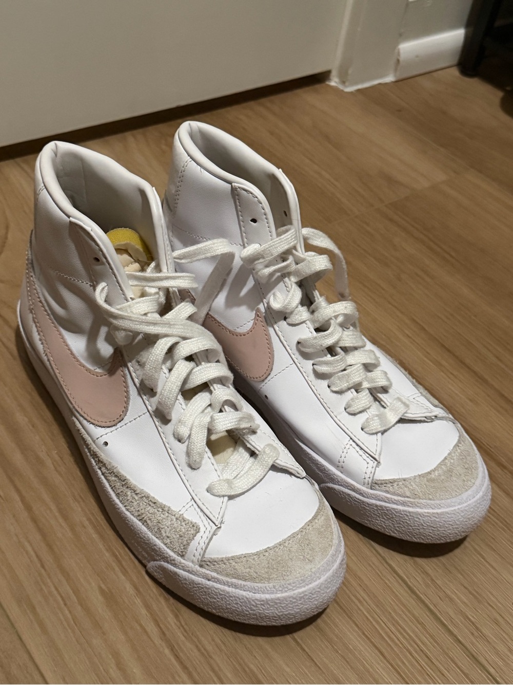 Nike Women’s White High-Top Sneakers with Blush Swoosh